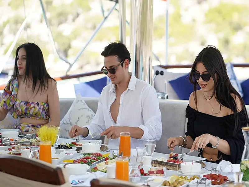 Ekmar Yachting Prenses Esila Gulet Yacht Cruise Exterior Anchored Aft Deck Al Fresco Dining Area With Sofa Guests Enjoying Lunch View